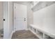 Bright mudroom with bench seating, cubbies, and coat hooks, providing ample storage at 522 Fern Hill Rd # 17, Mooresville, NC 28117