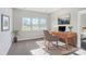 Inviting office space with a wooden desk, a comfortable chair, a houseplant, and natural light from the windows at 522 Fern Hill Rd # 17, Mooresville, NC 28117