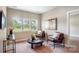 Cozy sitting room with comfortable seating and bright natural light from large windows at 522 Fern Hill Rd # 17, Mooresville, NC 28117