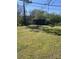 Large grassy backyard with utility shed, perfect for outdoor activities at 529 Devine St, Chester, SC 29706