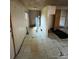 A utility room features outdated flooring, a hot water heater, and compact storage, needing renovation at 529 Devine St, Chester, SC 29706