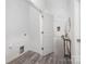 Bright hallway with modern flooring, leading to various rooms in the home at 5824 Patton St, Charlotte, NC 28269
