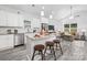 Open-concept kitchen and living area featuring stainless steel appliances and a comfortable, modern design at 5824 Patton St, Charlotte, NC 28269