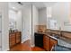 Well-lit kitchen features granite counters, stainless steel appliances and wood floors at 5980 Pale Moss Ln, Charlotte, NC 28269