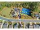 Overhead view of community tennis court, clubhouse, and parking area surrounded by lush trees and neighborhood streets at 6210 Skyline Dr, Charlotte, NC 28269