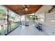 Spacious screened porch features a wood ceiling, ceiling fan, and view of the backyard at 6210 Skyline Dr, Charlotte, NC 28269
