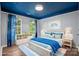 Stylishly staged bedroom with unique ceiling at 6210 Skyline Dr, Charlotte, NC 28269