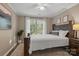 Cozy bedroom featuring a large window, natural light, and neutral decor at 6210 Skyline Dr, Charlotte, NC 28269