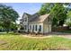 Charming two-story home featuring a two-car garage and manicured lawn with tasteful landscaping at 6210 Skyline Dr, Charlotte, NC 28269