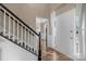Foyer with wooden floors, black stair railing, with view of a living area with natural light at 6210 Skyline Dr, Charlotte, NC 28269