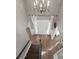 Foyer with wooden floors, chandelier, and staircase leading to the main level at 6210 Skyline Dr, Charlotte, NC 28269