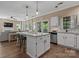 Modern kitchen with an island, stainless steel appliances, and hardwood floors at 6210 Skyline Dr, Charlotte, NC 28269