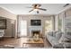 Inviting living room with a brick fireplace, large windows, and a comfortable sofa at 6210 Skyline Dr, Charlotte, NC 28269