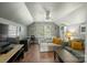 Bright bonus room with seating area, desk, and shelving at 6210 Skyline Dr, Charlotte, NC 28269