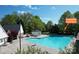 Community pool with a gazebo and seating at 6210 Skyline Dr, Charlotte, NC 28269