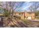 Brick home featuring a back deck, a garage and a partially wooded lot providing both privacy and outdoor space at 624 Flicker St, Concord, NC 28027