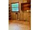 This laundry room has wooden walls, shelves, and an exposed window to the outdoors at 624 Flicker St, Concord, NC 28027