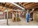 Unfinished basement with exposed brick walls, wooden ceiling, and support beams at 719 N Fulton St, Salisbury, NC 28144