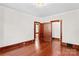 Bedroom with hardwood floors, wooden trim windows and multiple entryways with wooden trim at 719 N Fulton St, Salisbury, NC 28144