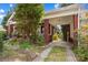 Brick carport of this charming home showing the beautiful side yard and landscaping at 719 N Fulton St, Salisbury, NC 28144