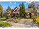 Charming brick home featuring mature landscaping, a covered carport, and beautiful curb appeal at 719 N Fulton St, Salisbury, NC 28144