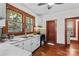 Bright kitchen with white cabinets, marble countertops, and stainless steel appliances at 719 N Fulton St, Salisbury, NC 28144