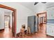 An additional view of the kitchen features a refrigerator, an eating space, and wood floors at 719 N Fulton St, Salisbury, NC 28144