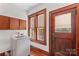 Bright laundry room featuring a new washer and a window with natural light at 719 N Fulton St, Salisbury, NC 28144