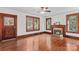 Living room boasting hardwood floors, fireplace, windows and doorway views into the adjacent room at 719 N Fulton St, Salisbury, NC 28144