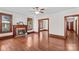 Bright living room featuring hardwood floors, a fireplace, and ample space at 719 N Fulton St, Salisbury, NC 28144