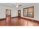 Spacious living room featuring hardwood floors, bright windows and 2 open doorways at 719 N Fulton St, Salisbury, NC 28144