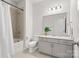 Clean, modern bathroom with tiled shower/tub, gray vanity, and contemporary fixtures at 722 Herlong Ave, Rock Hill, SC 29732