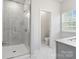 Bathroom featuring a glass shower, neutral tile, and modern fixtures at 722 Herlong Ave, Rock Hill, SC 29732