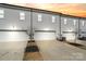 Row of new construction townhomes showcasing driveways and gray siding at sunset at 722 Herlong Ave, Rock Hill, SC 29732