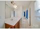 Bright bathroom featuring a sleek vanity and a well-lit mirror with storage room inside at 746 Elders Story Rd, Fort Mill, SC 29708