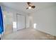 Bedroom features large closet, bright bathroom access, and a neutral carpet and paint scheme at 746 Elders Story Rd, Fort Mill, SC 29708