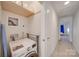 Convenient laundry area with a modern washer and storage shelving above at 746 Elders Story Rd, Fort Mill, SC 29708