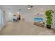 Bright living room with light wood floors, an open floor plan, and a modern ceiling fan at 746 Elders Story Rd, Fort Mill, SC 29708