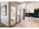 Modern kitchen featuring stainless steel appliances, pantry, and stylish countertops at 8026 Cedarsmith Ct, Charlotte, NC 28217