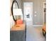 Hallway view featuring neutral walls and trim leading into an adjacent office and walk-in closet at 8034 Cedarsmith Ct, Charlotte, NC 28217