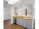 Kitchen featuring wood countertops, gray cabinets, and stainless steel dishwasher at 8539 Glenway Ct, Charlotte, NC 28226