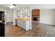 Cozy kitchen featuring wood countertops, gray cabinets, and hardwood floors at 8539 Glenway Ct, Charlotte, NC 28226