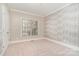 Cozy bedroom with carpet flooring, and a window providing natural light at 8704 Dartmoor Pl, Mint Hill, NC 28227
