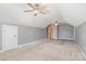 Large bedroom with carpet flooring, ceiling fans, and lots of natural light at 8704 Dartmoor Pl, Mint Hill, NC 28227