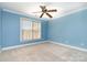 Bright bedroom with carpet flooring, and a window providing natural light at 8704 Dartmoor Pl, Mint Hill, NC 28227