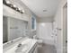 Clean bathroom featuring a shower and tub, vanity, and neutral tile flooring at 89 Fifth St, York, SC 29745