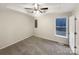 Neutral bedroom with a ceiling fan and a large window at 89 Fifth St, York, SC 29745