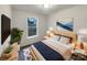 Comfortable bedroom featuring a cozy bed with throw pillows, a window, and stylish decor at 89 Fifth St, York, SC 29745