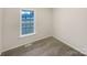 Neutral bedroom showcasing a window that lets in natural light at 89 Fifth St, York, SC 29745