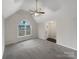 Open living room with large window and vaulted ceilings at 89 Fifth St, York, SC 29745